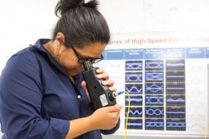 student in optical lab