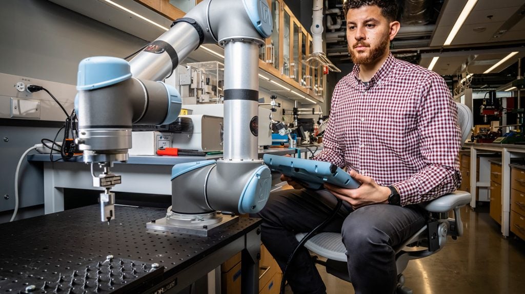 APL researcher operates a robotic arm