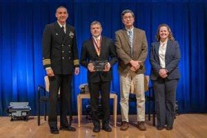 Photo of Michael Robert receiving Taylor Award